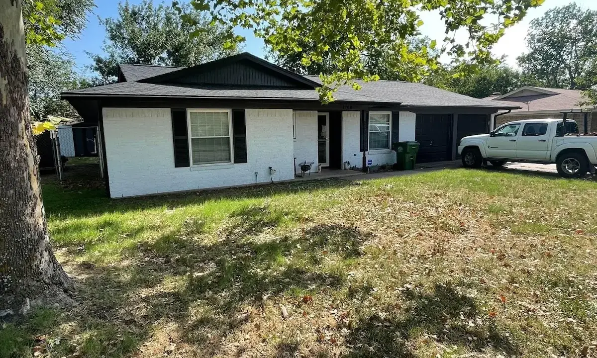 Professional roofing crew working on a residential roof in Hamilton